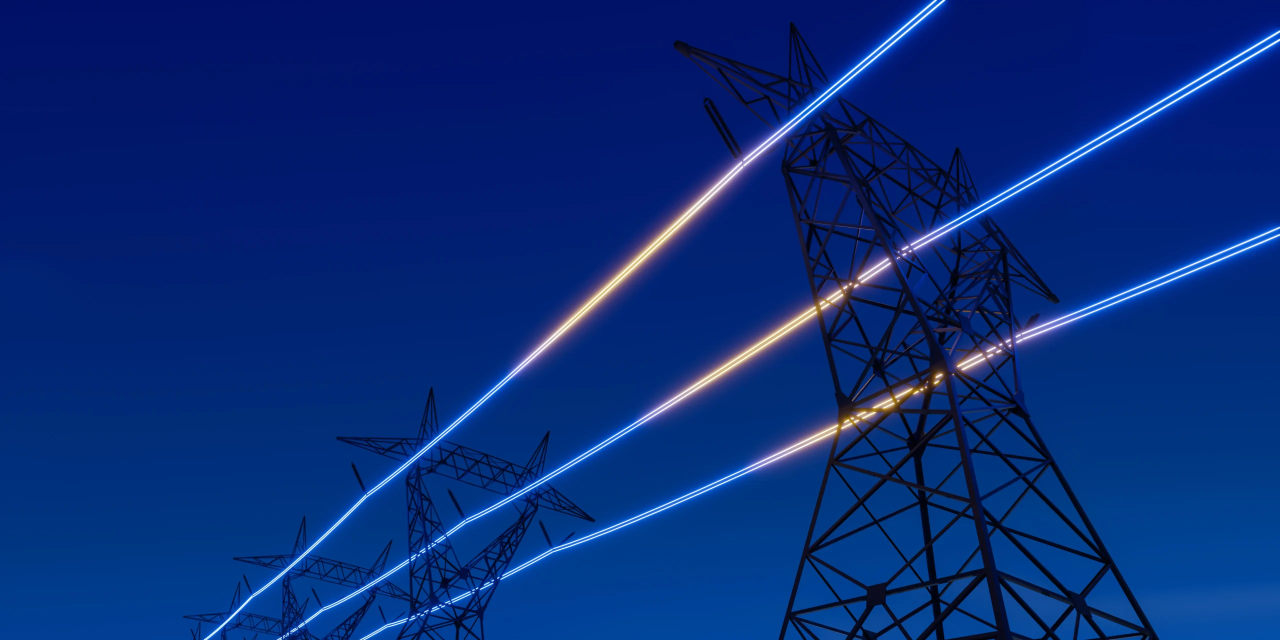 Electrical transmission towers and illuminated power lines at night
